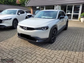 Mazda MX-30 eSKYACTIV/110HP/MAKOTO/PANO/HUD/MEMO/360/BOSE/998g - Car24.bg Mazda MX-30 eSKYACTIV/110HP/MAKOTO/PANO/HUD/MEMO/360/BOSE/998g