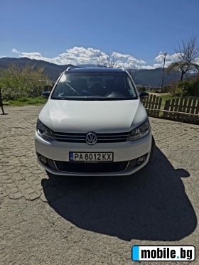     VW Touran ~17 599 .