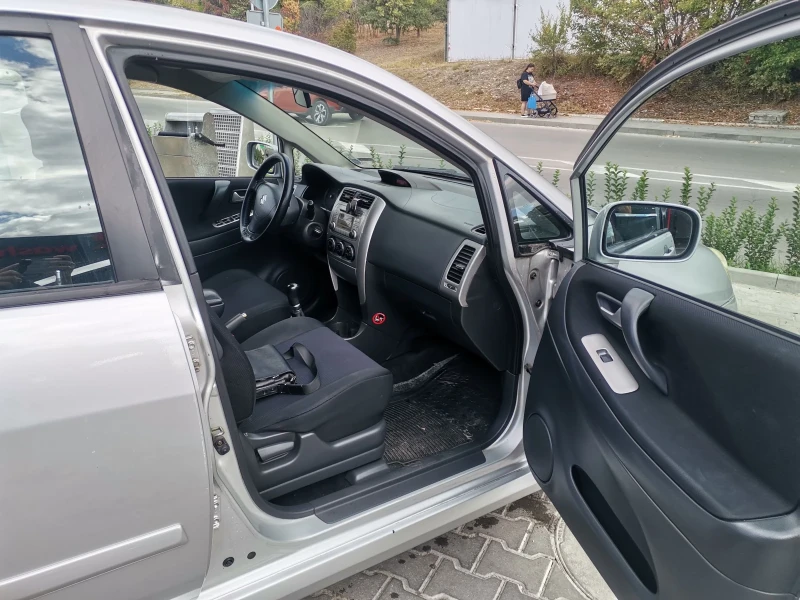 Suzuki Liana, снимка 7 - Автомобили и джипове - 51836066