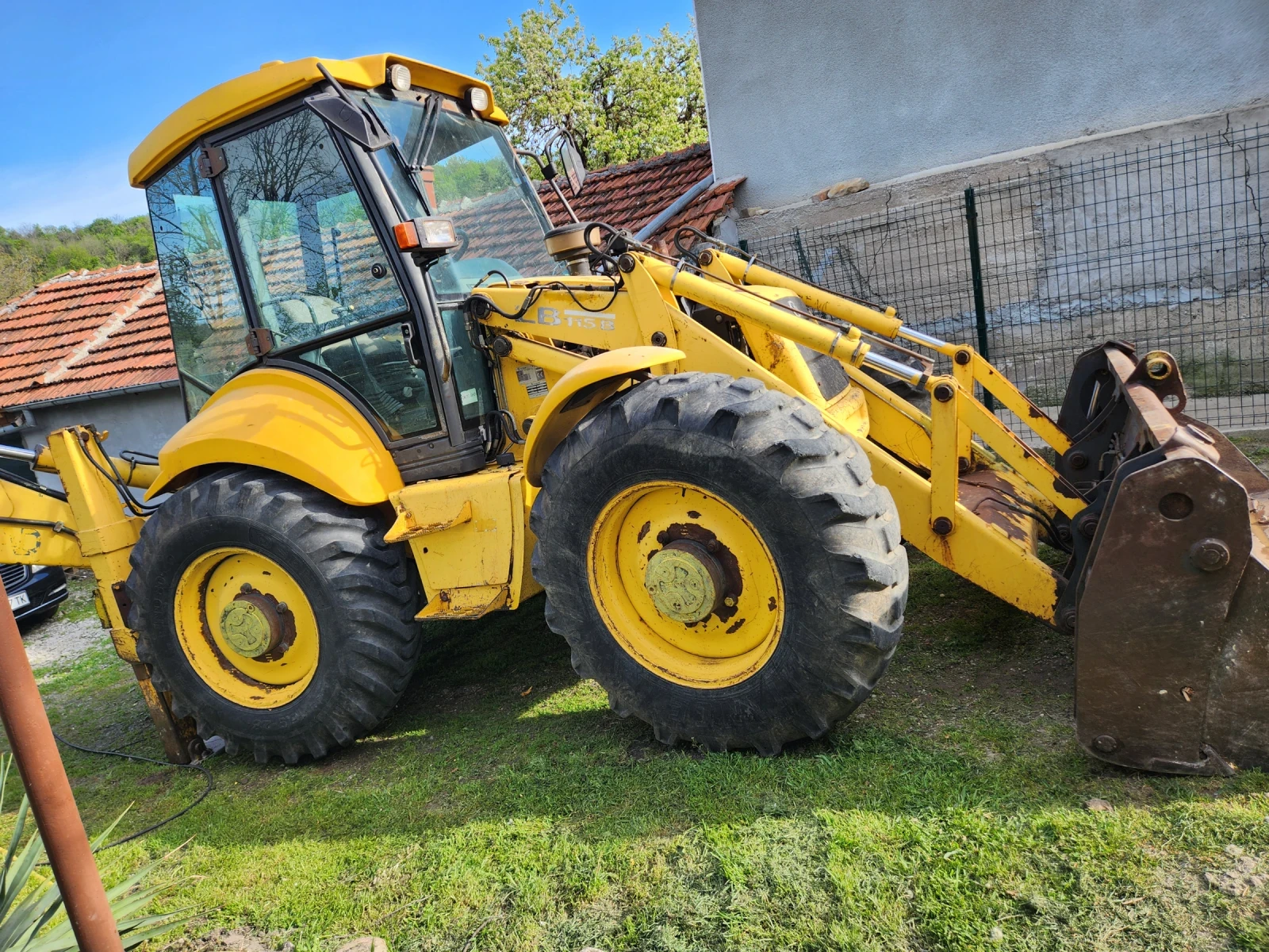 Багер New Holland LB115B