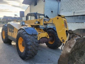 Телескопични товарачи Caterpillar TH 407, снимка 5