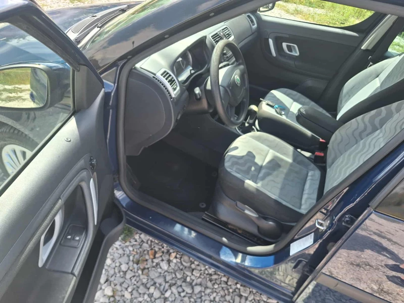 Skoda Roomster 1.2i klima, снимка 12 - Автомобили и джипове - 52079532