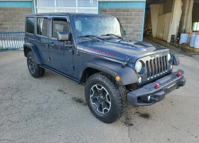 Обява за продажба на Jeep Wrangler UNLIMITED RUBICON HARD ROCK ~24 200 лв. - изображение 1 | Auto.bg Обява за продажба на Jeep Wrangler UNLIMITED RUBICON HARD ROCK ~24 200 лв. - изображение 1