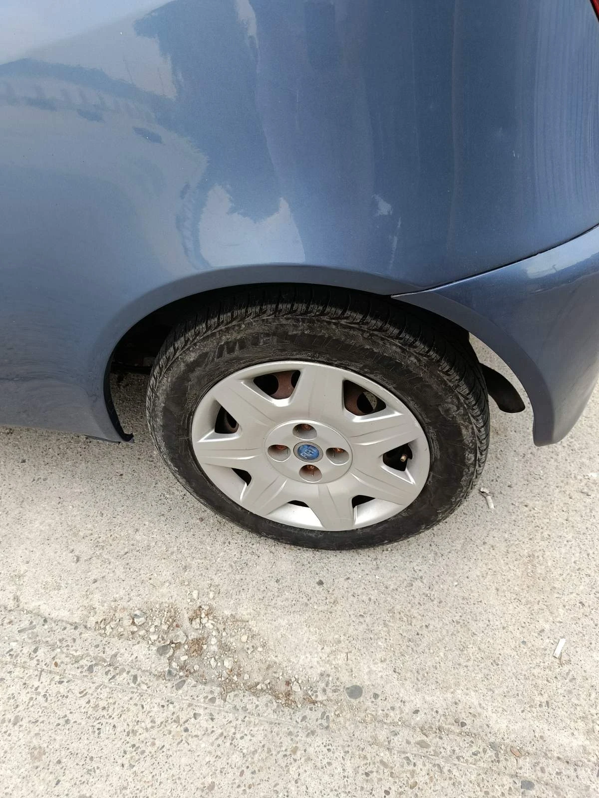 Fiat Punto 1.2 60к.с фейслифт - изображение 8