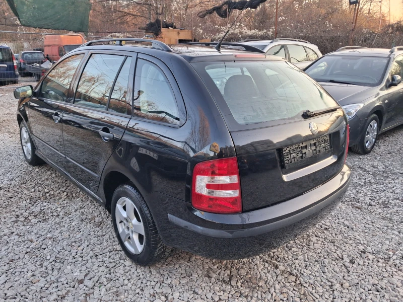 Skoda Fabia 1.4i* * КЛИМА* * КОМБИ, снимка 5 - Автомобили и джипове - 52868780
