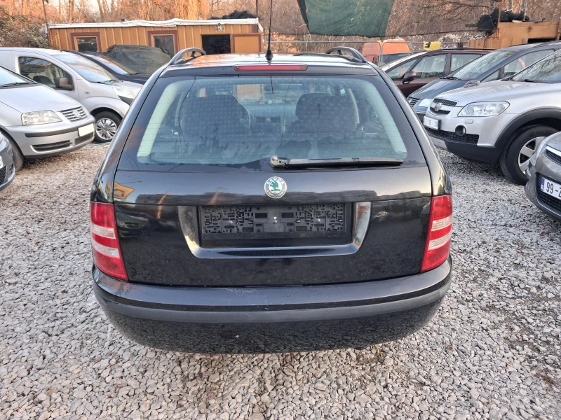 Skoda Fabia 1.4i* * КЛИМА* * КОМБИ, снимка 4 - Автомобили и джипове - 52868780