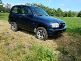 Suzuki Grand vitara 2.0бензин с климатик143хил км., снимка 13