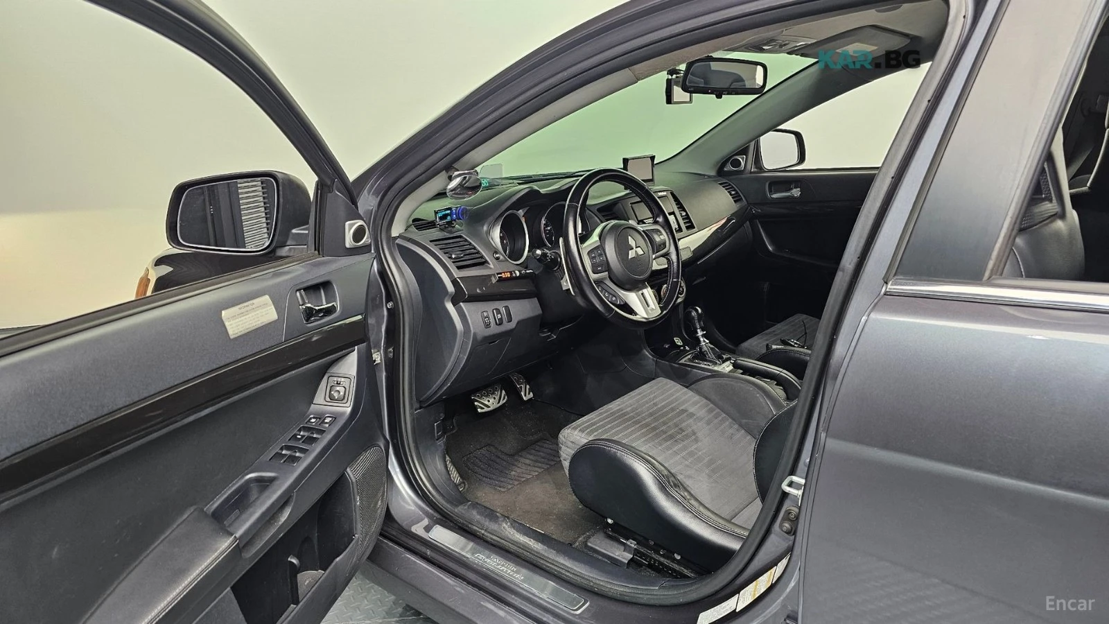 Mitsubishi Lancer EVOLUTION / CARBON / DCT / HEADUP / ENKEI, снимка 10 - Автомобили и джипове - 54595916