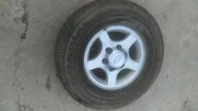 Гуми с джанти Nokian 235/75R15, снимка 1