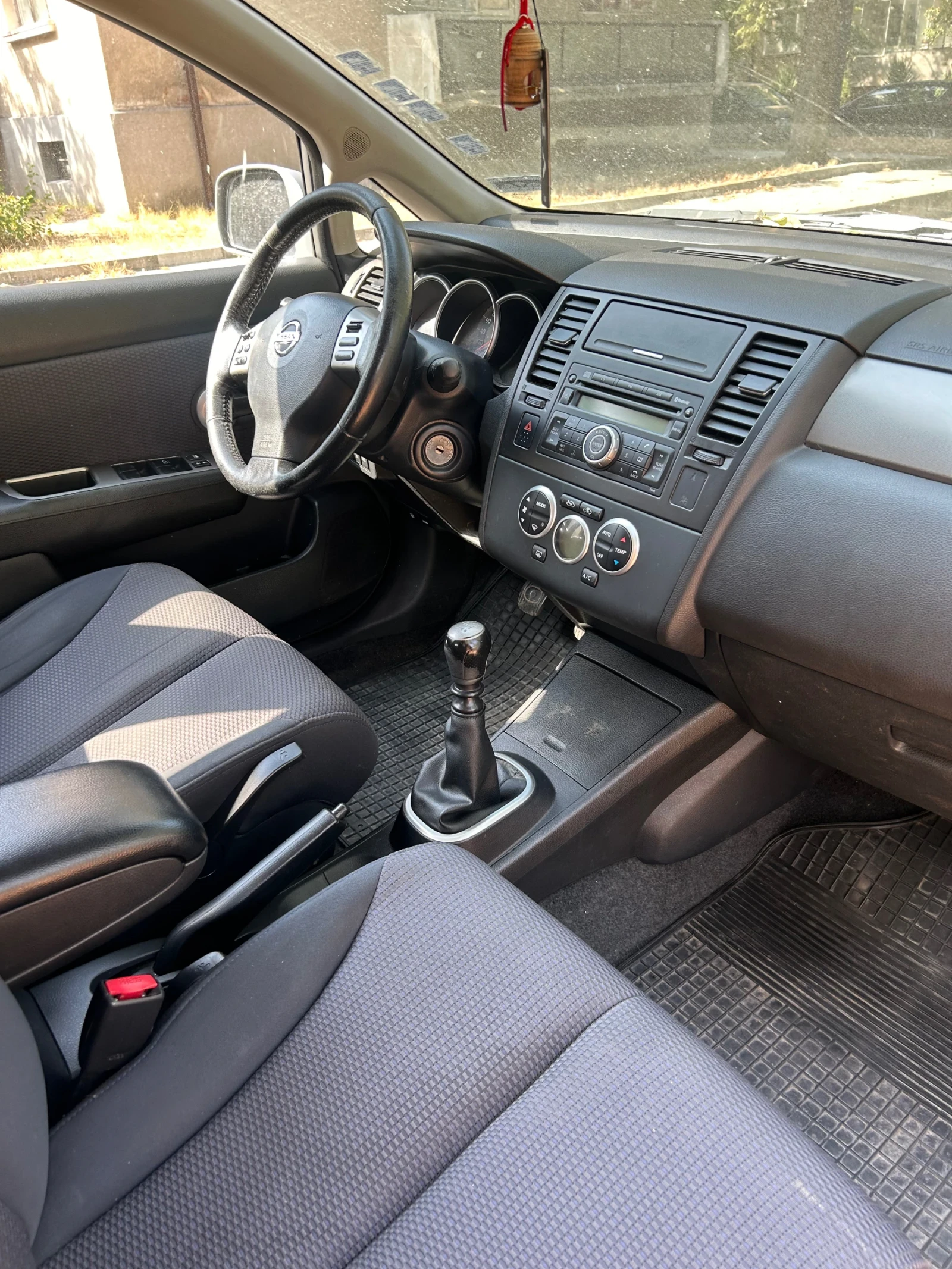 Nissan Tiida  - изображение 4