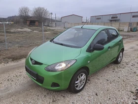 ������ Mazda 2