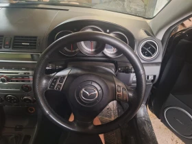 ������ Mazda 3