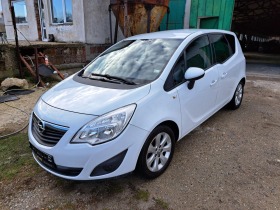     Opel Meriva ~7 000 .