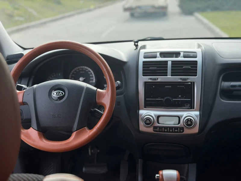 Kia Sportage 2.7/4WD/АВТОМАТ/ТОП, снимка 16 - Автомобили и джипове - 53539264