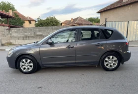 Mazda 3 1.4i* 153000км* 2 комплекта гуми* Климатик - 1499 € / 2931.79 лв. - 19714645 3