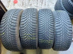 Гуми Зимни 215/65R16, снимка 1 - Гуми и джанти - 38496302