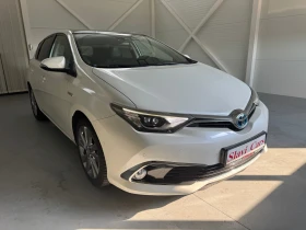 Toyota Auris HYBRID - AUTO/ LINE ASS/ HEAT/ PANORAMA - 24400 лв. - 77471692 3