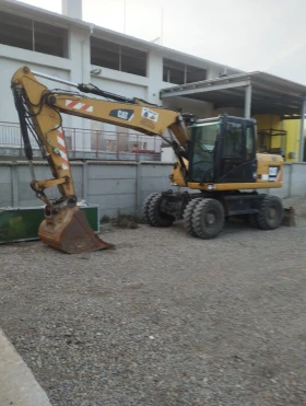 Багер Cat 313 D