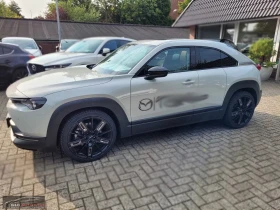 Mazda MX-30 eSKYACTIV/110HP/MAKOTO/PANO/HUD/MEMO/360/BOSE/998g - 25599 € / 50067.29 лв. - 85819392 2