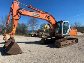      New Holland E215B