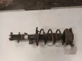 амортесьор преден ляв Нисан Микра 1.4б