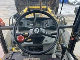 Багер New Holland 110B, снимка 13