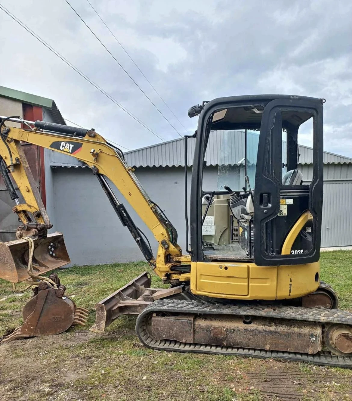 Багер Caterpillar 303C