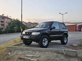     Kia Sportage 2.0i 128 . +  