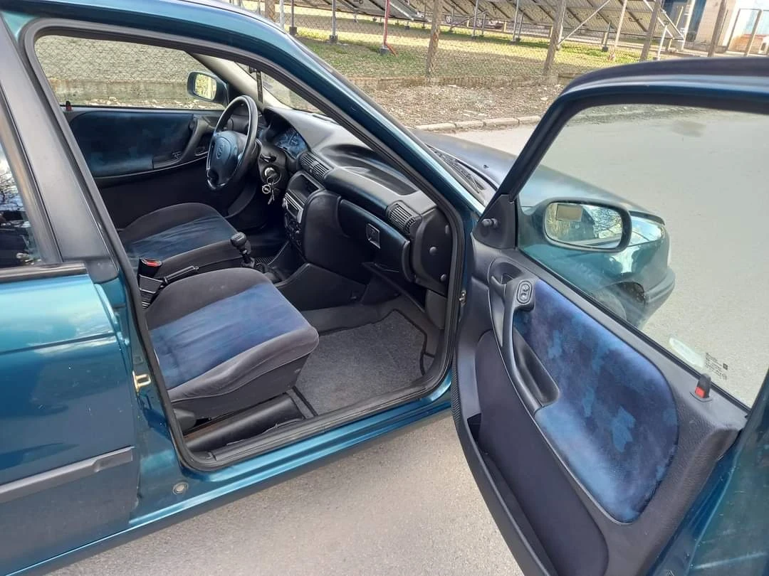 Opel Astra 1.4/82 коня/Климатик , снимка 14 - Автомобили и джипове - 54303420
