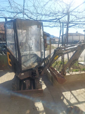 Багер Volvo EC15D 