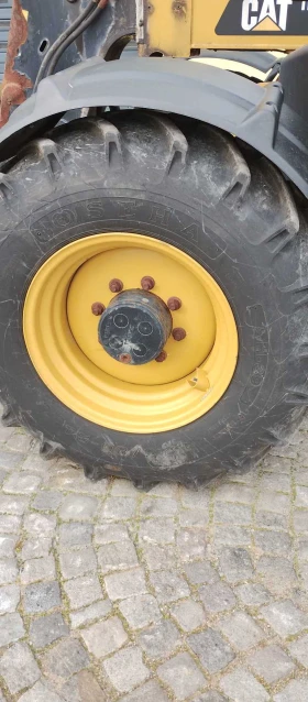 Телескопичен товарач Caterpillar TH337C, снимка 13