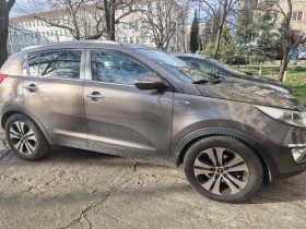 Kia Sportage 2.0d-4x4-Navi-Kamera-Euro-5 - 9000 € / 17602.47 лв. - 49190123 2