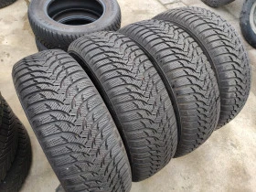 Гуми Зимни 215/65R16, снимка 6 - Гуми и джанти - 43953229