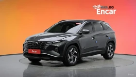 Hyundai Tucson 2.0 4WD PREMIUM* КОЖА* ОБДУХВ* НАВИ* КАМЕРА, снимка 1