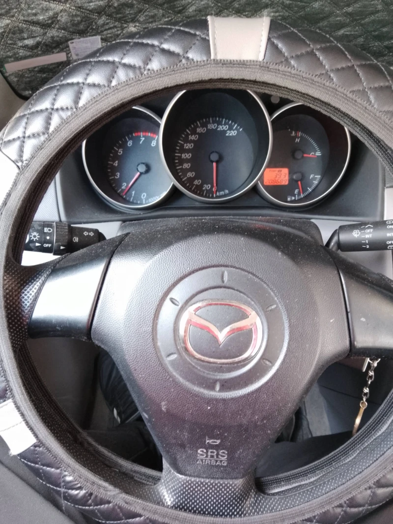 Mazda 3 1.4i, снимка 9 - Автомобили и джипове - 49421442