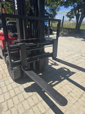 Мотокар Nissan 2.0 ton, движение на вилиците ляво-дясно, снимка 2
