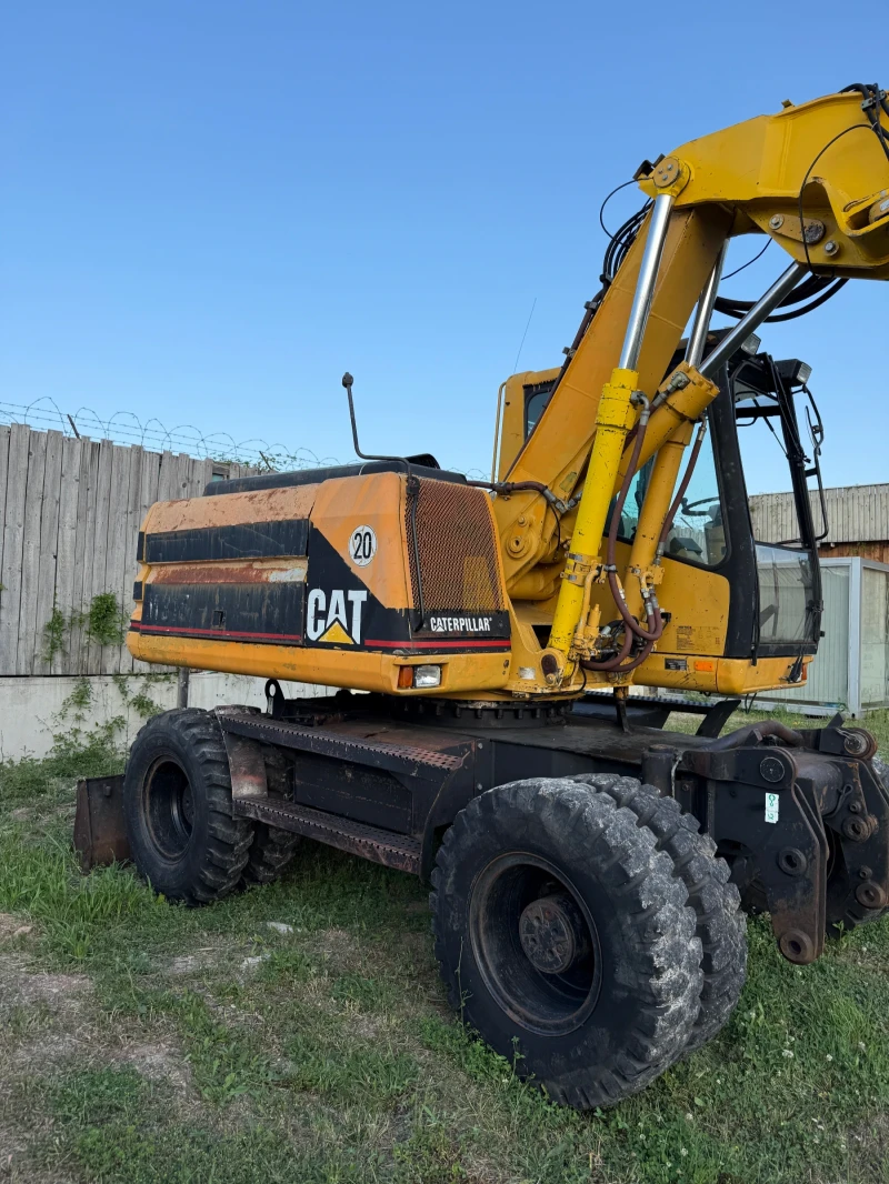 Багер Caterpillar M315