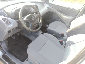 Nissan Almera tino 1.8  КЛИМА, снимка 11